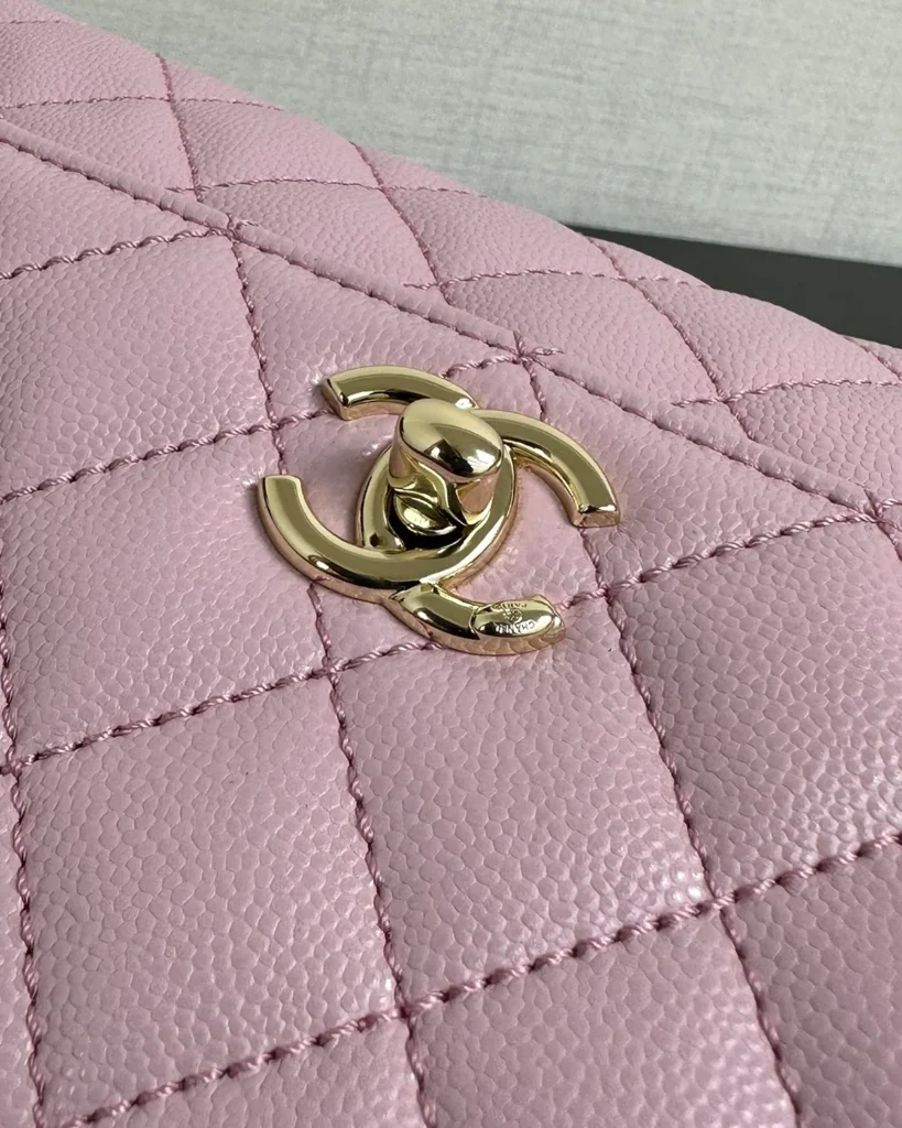 Light Pink Quilted Top-Handle Flap Bag — logo detail view