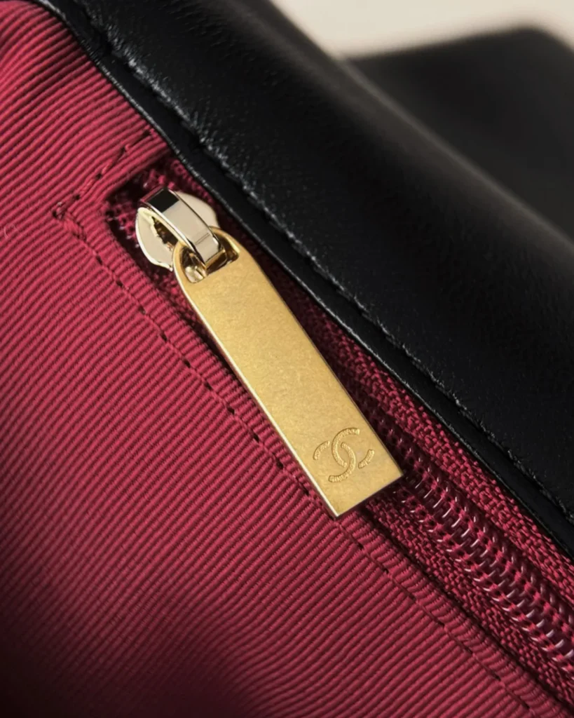 Black Quilted Mixed-Chain Flap Bag — zipper detail view