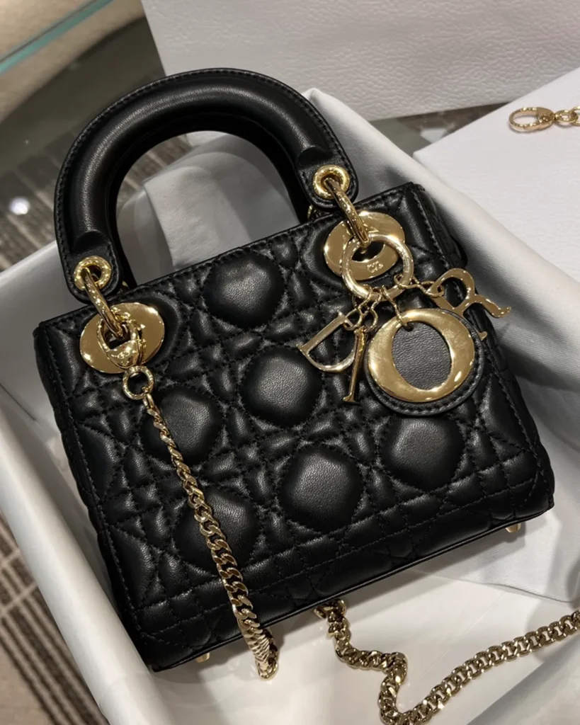 Black Quilted Chain Top Handle Bag — front view