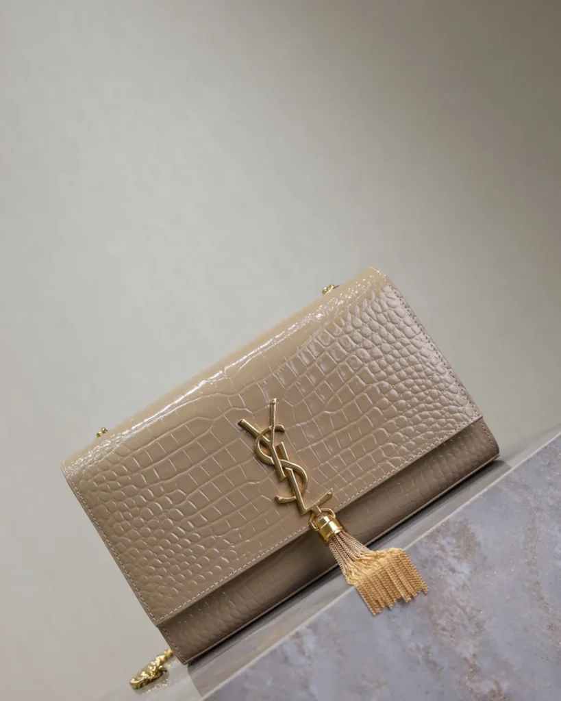 Taupe Embossed Tassel Chain Bag — angled front view