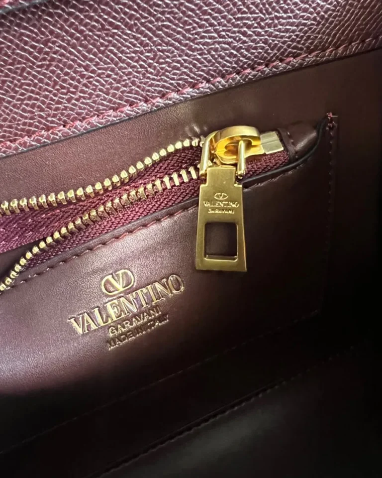 Burgundy Pearl-Effect Emblem Top-Handle Bag — interior label view