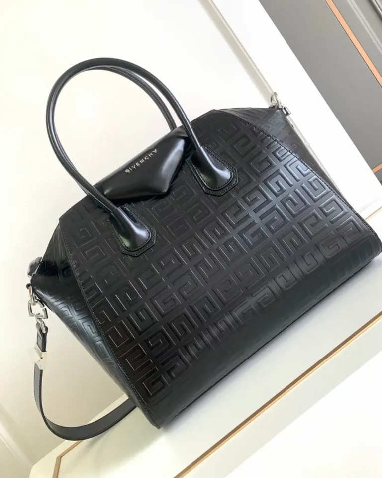 Black Geometric Embossed Twin-Handle Satchel — angled front