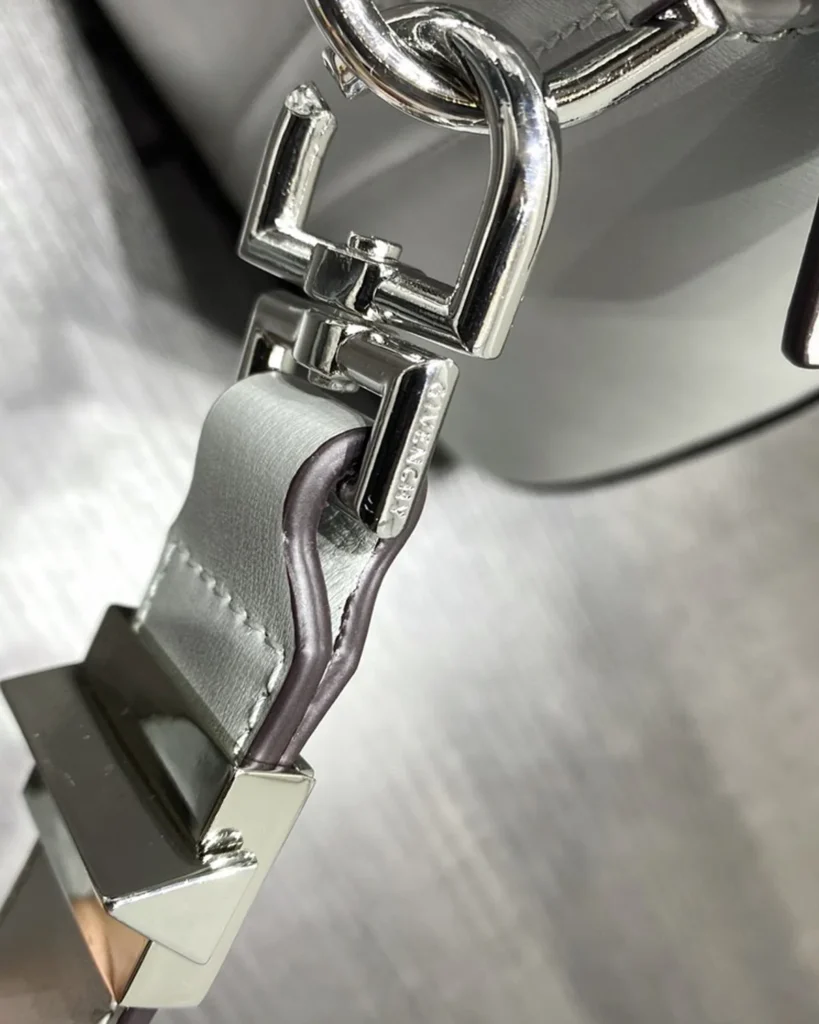 Pale Grey Architectural Top Handle Bag — clip detail view