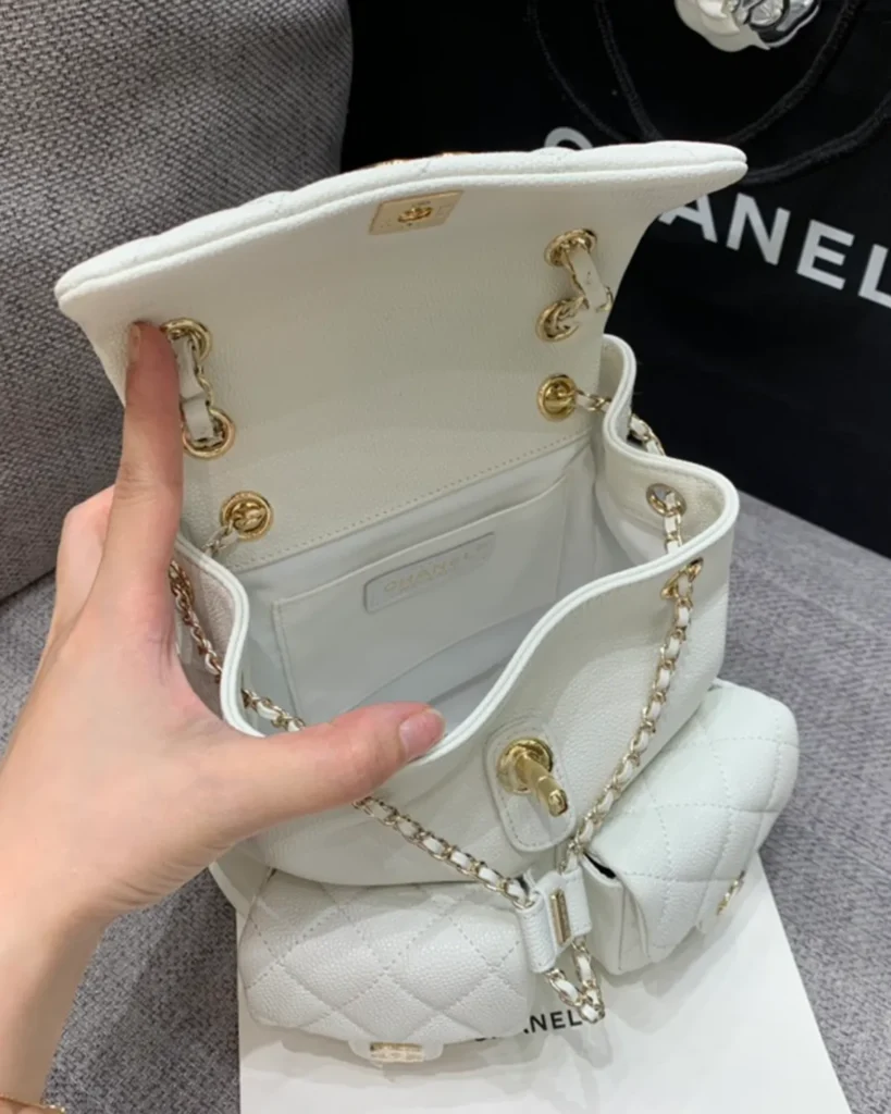 Ivory Quilted Twin-Pocket Backpack — open interior view