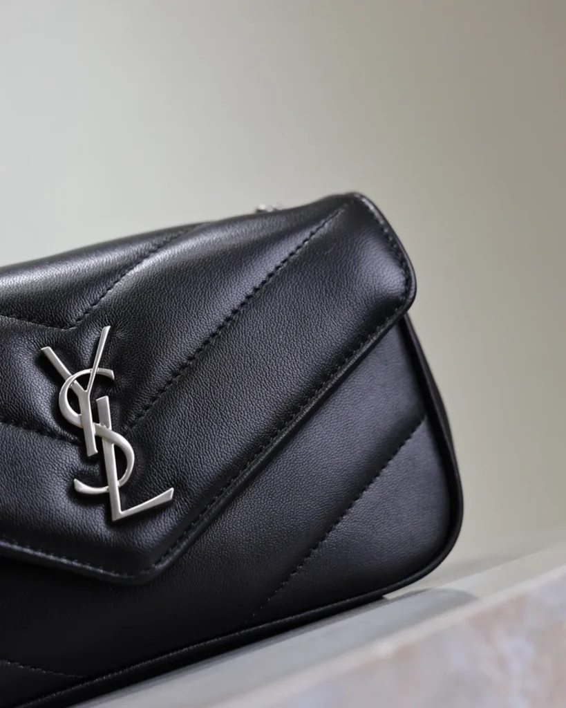 Black Chevron Flap Bag with Silver-Tone Chain — flap detail view