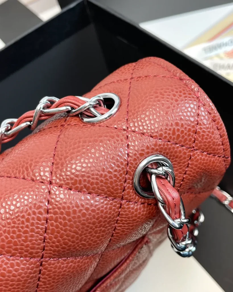 Rust Red Quilted Chain Flap Bag — strap detail view