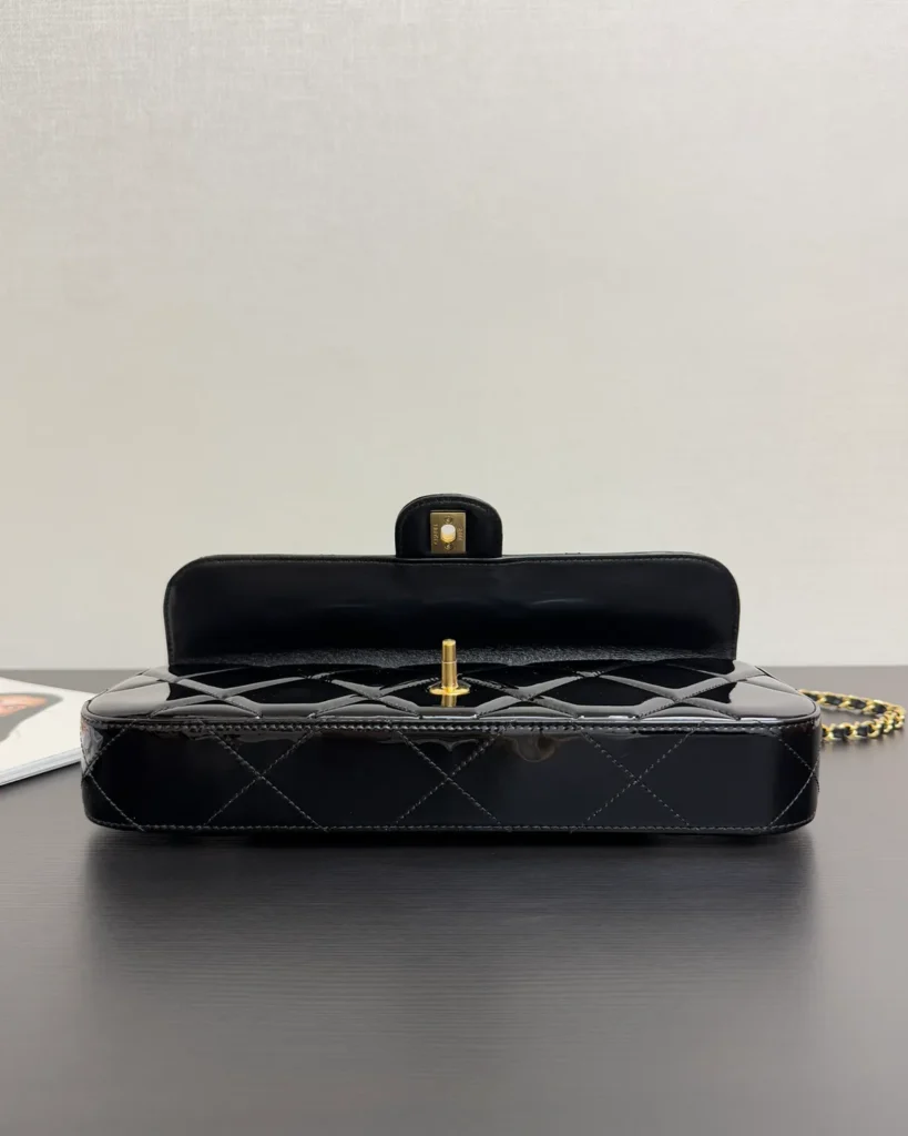 Glossy Black Quilted Handle Clutch — open interior view