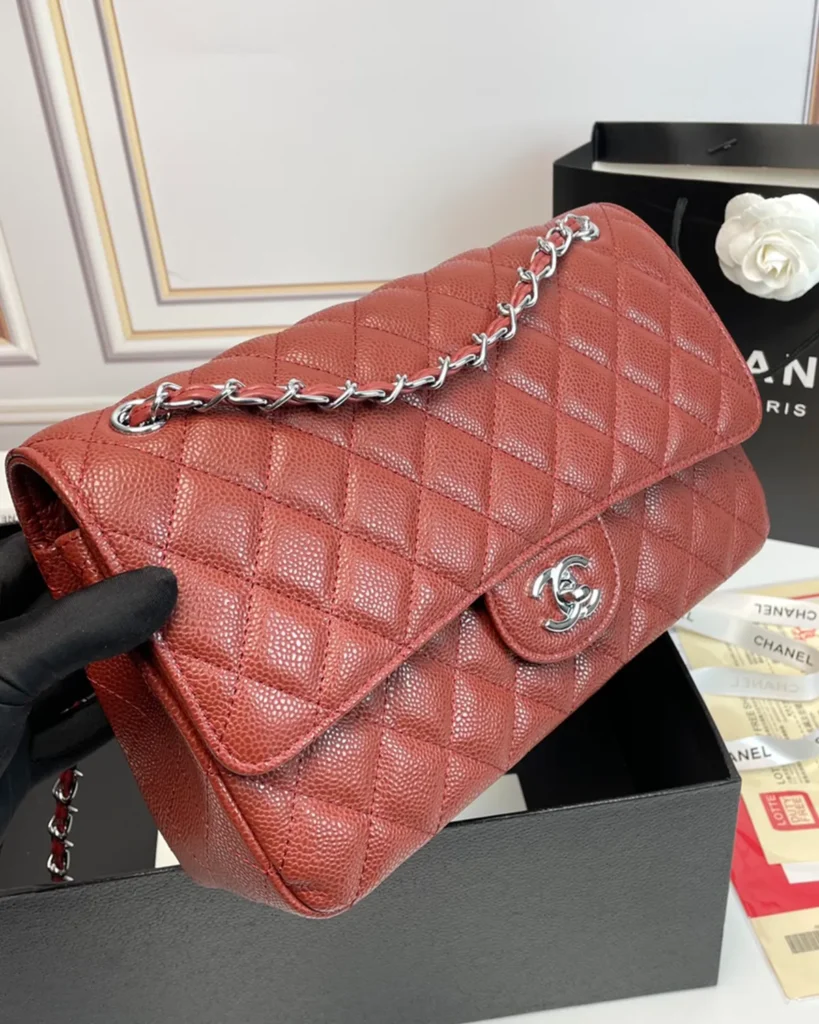Rust Red Quilted Chain Flap Bag — angled front view