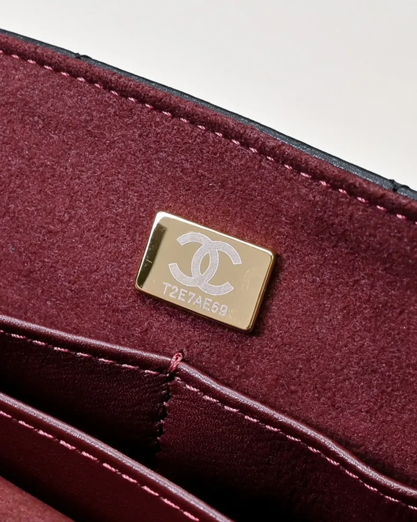 Black Quilted Top-Handle Flap Bag — interior detail view