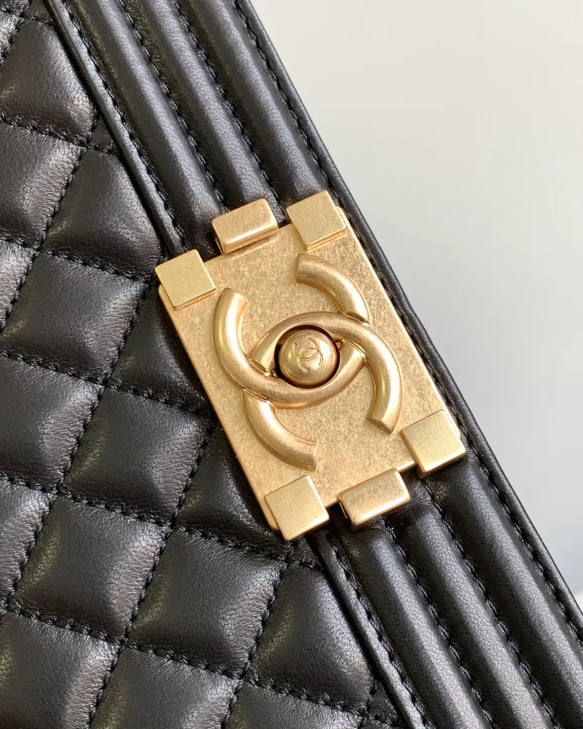 Black Quilted Frame Flap Chain Bag — clasp detail view