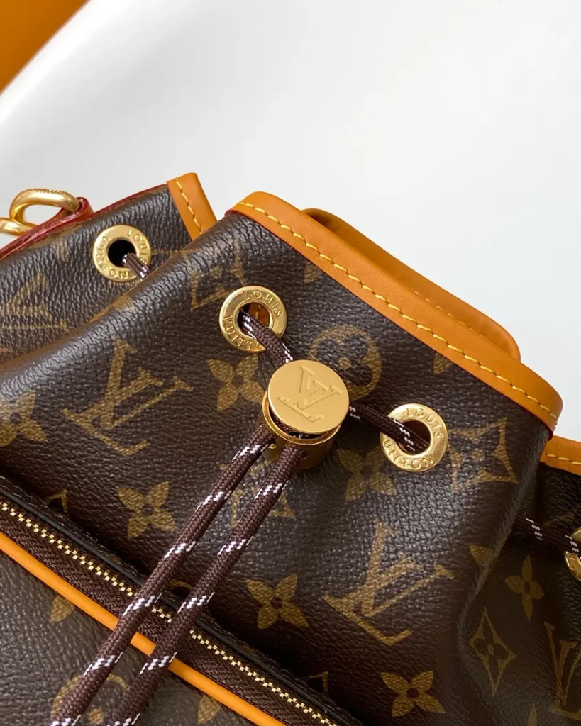 Brown Monogram Drawstring Bucket Bag with Front Pocket — drawstring view