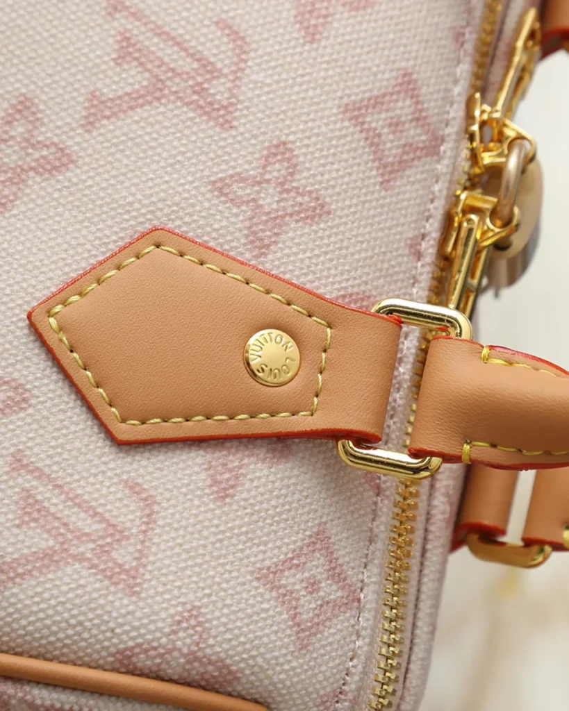 Pink Cream Monogram Boston Bag — handle tab view