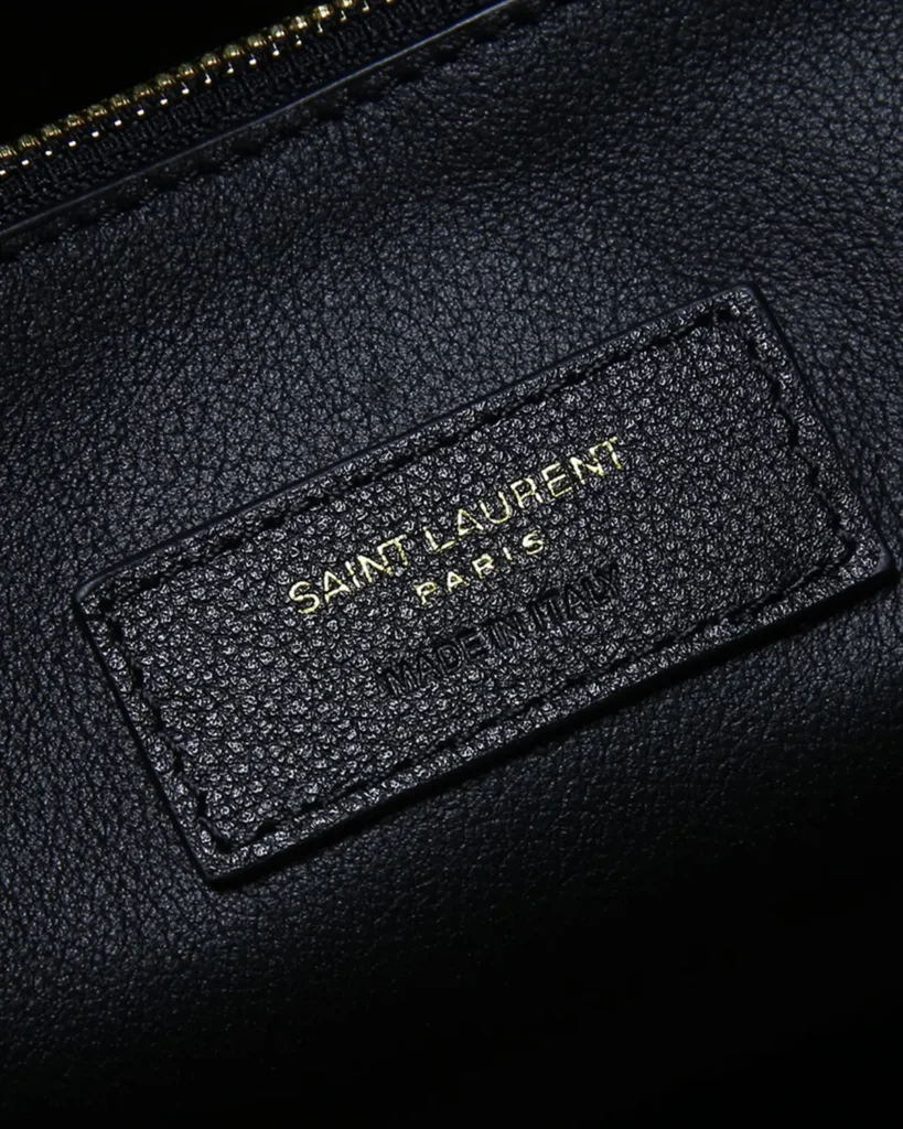 Black Curved-Top Shoulder Bag — label detail view