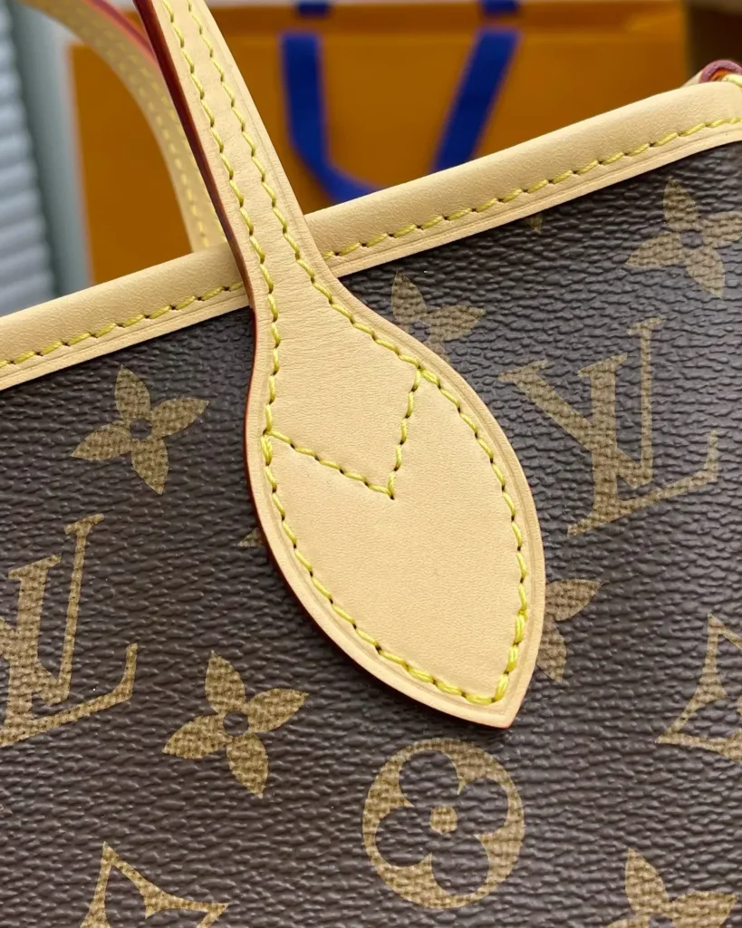Brown Monogram Mini Tote with Round Pouch — handle tab view