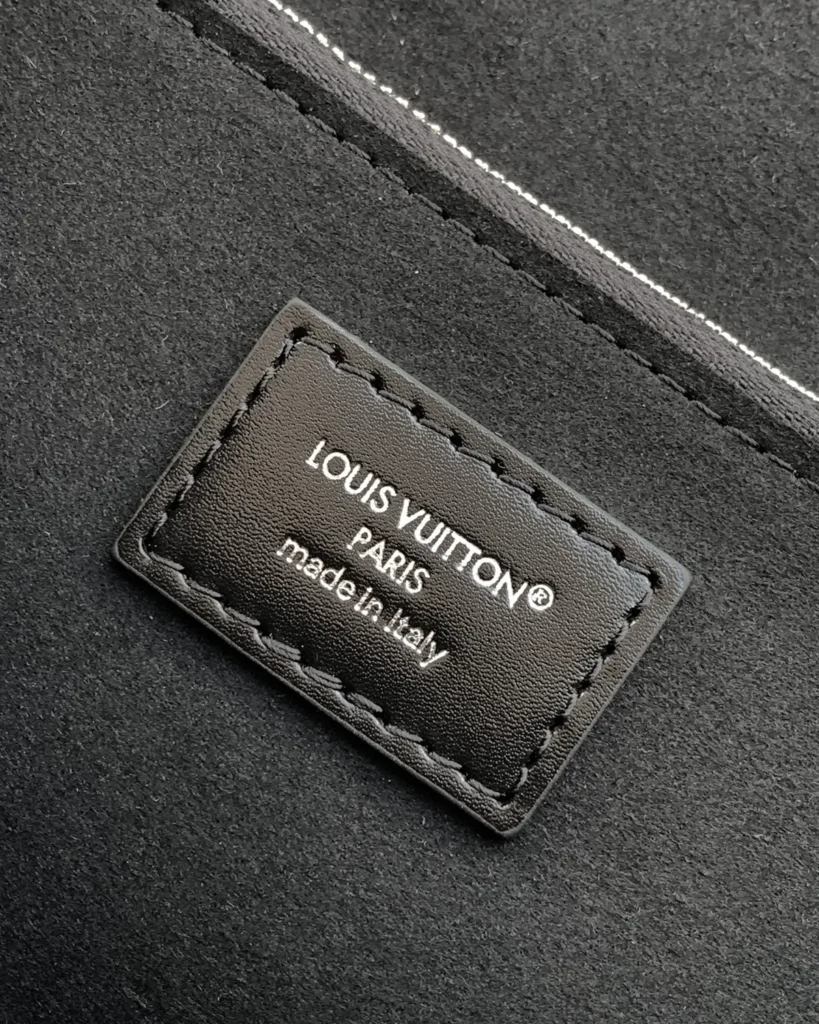 Black Embossed Chain Flap Bag — interior label view
