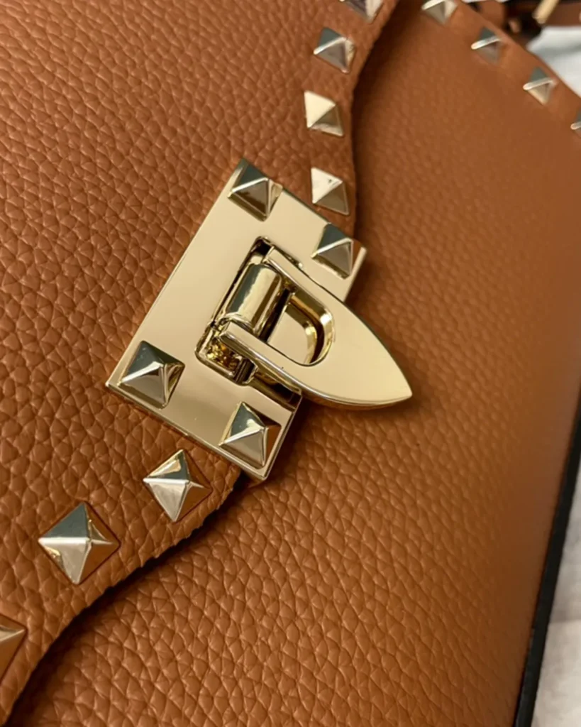 Tan Studded Edge Flap Shoulder Bag — closure detail view