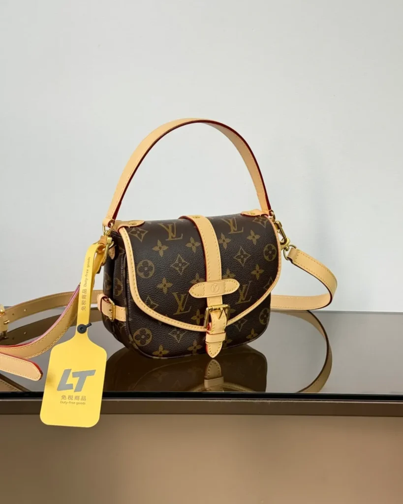 Brown Monogram Tan-Trim Saddle Bag — three quarter view