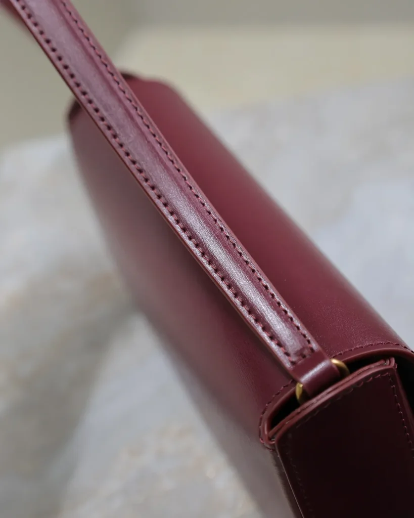 Burgundy Curved-Flap Shoulder Bag — strap detail view