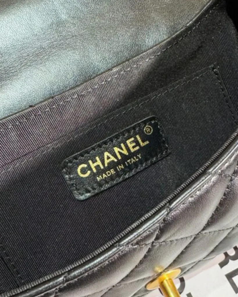 Black Rounded Quilted Top-Handle Bag — interior label view