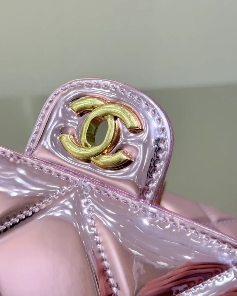 Metallic Pink Quilted Top-Handle Bag — clasp detail view