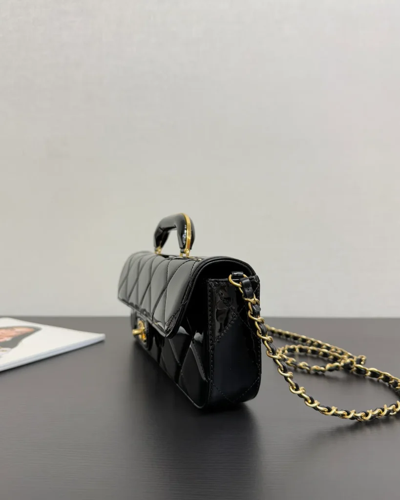 Glossy Black Quilted Handle Clutch — side view