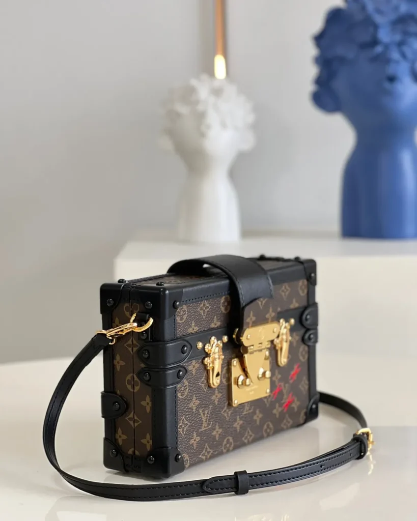 Brown Monogram Black-Trim Trunk Bag — side view