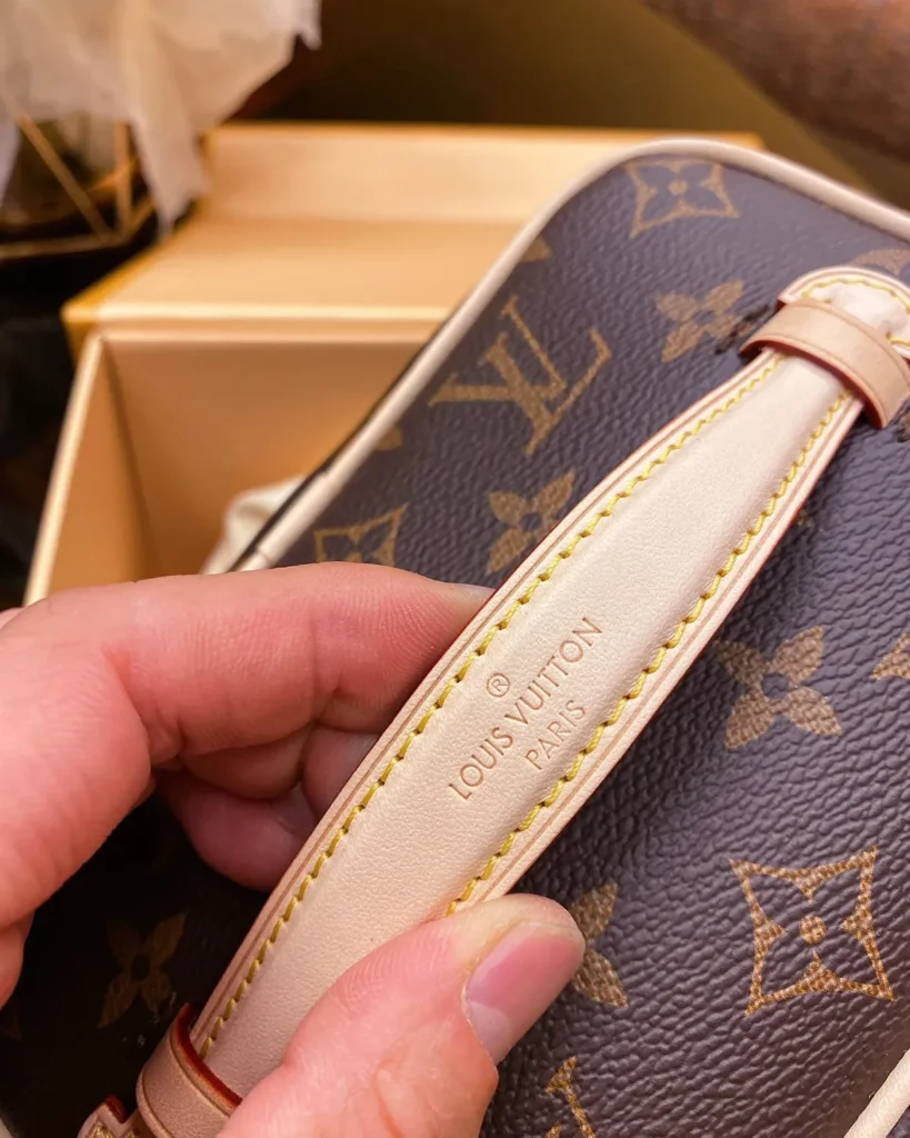 Brown Monogram Top Handle Vanity Case — handle detail view