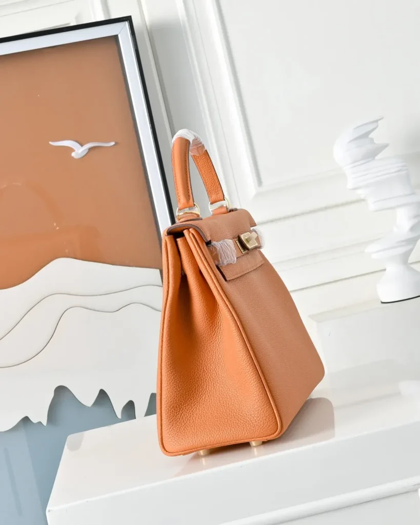 Kelly-Inspired 28 Orange Structured Top-Handle Bag, side profile