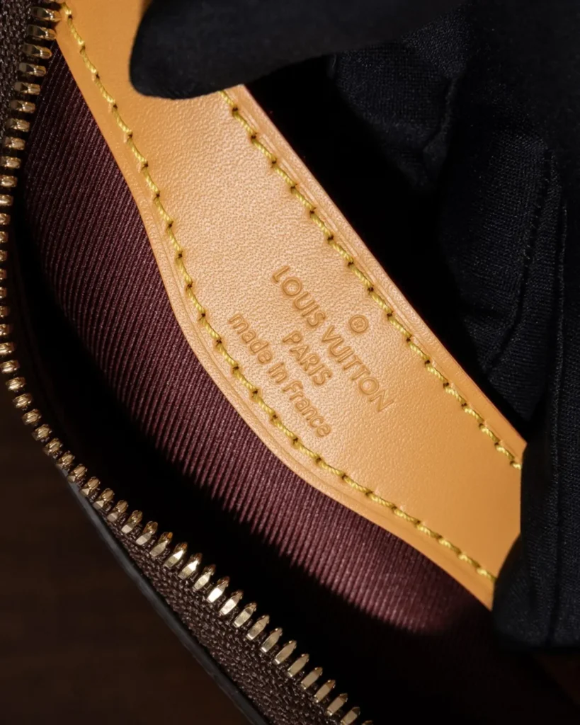 Brown Monogram Crescent Bag with Tan Corners — interior label view