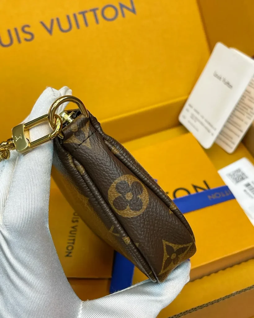 Brown Monogram Mini Chain Zip Pouch — side view