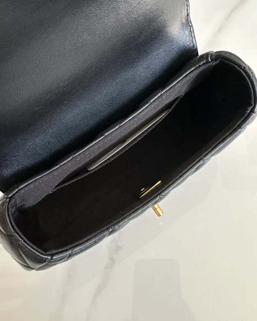 Black Rounded Quilted Top-Handle Bag — interior view