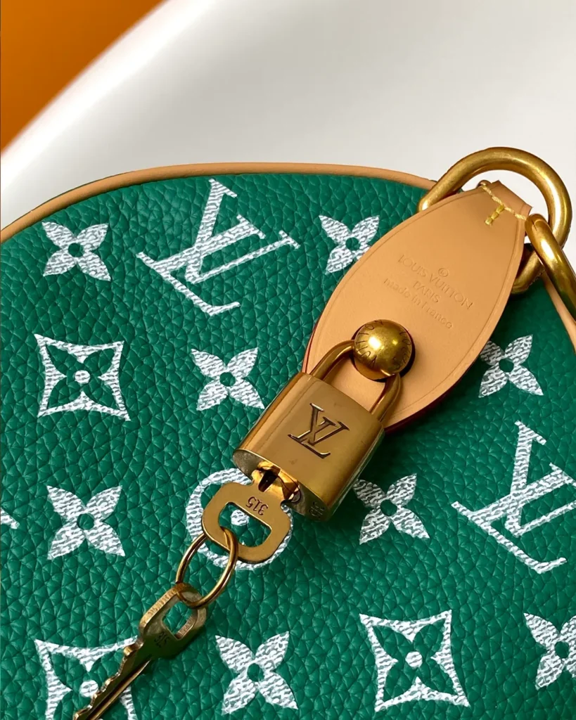 Green and White Monogram Duffle Bag — strap clasp view