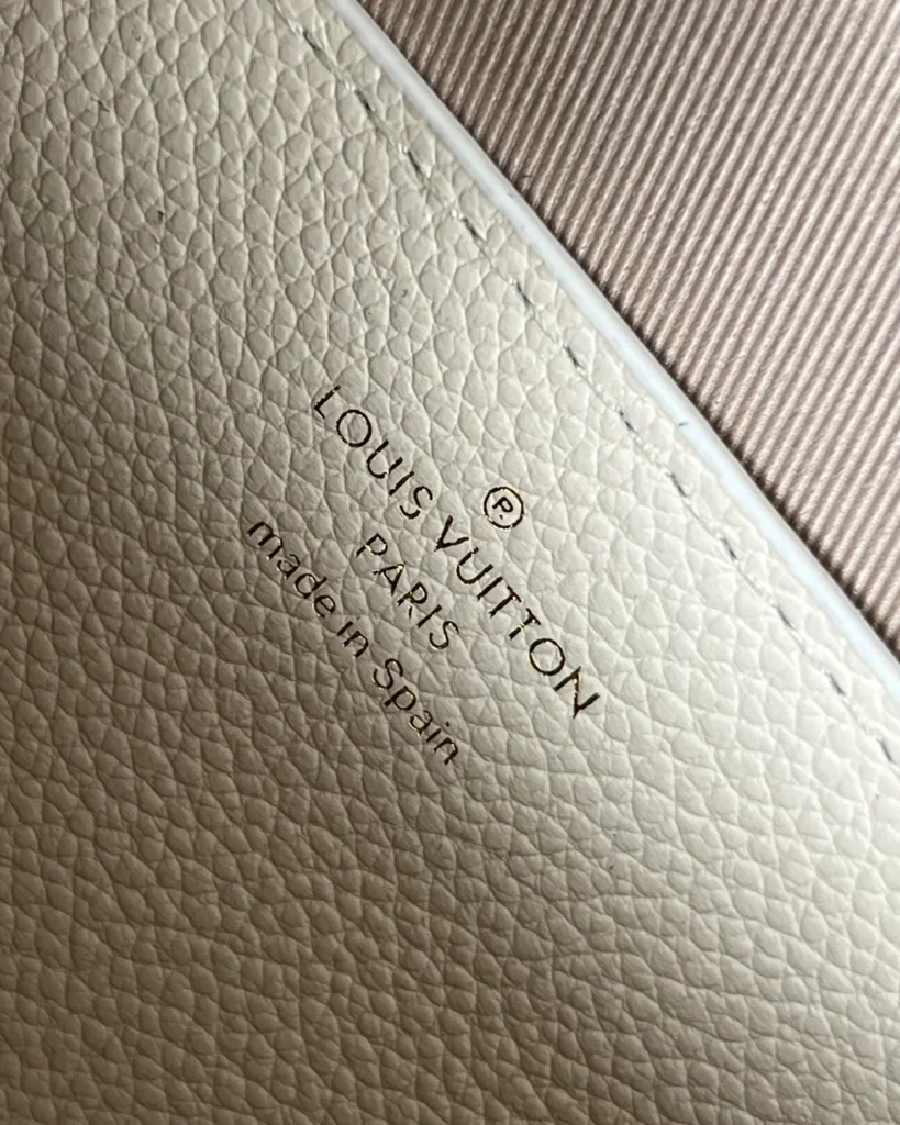 Cream Embossed Flap Chain Wallet — interior detail view