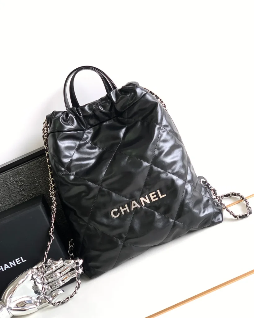 Glossy Black Quilted Gathered Tote — front view