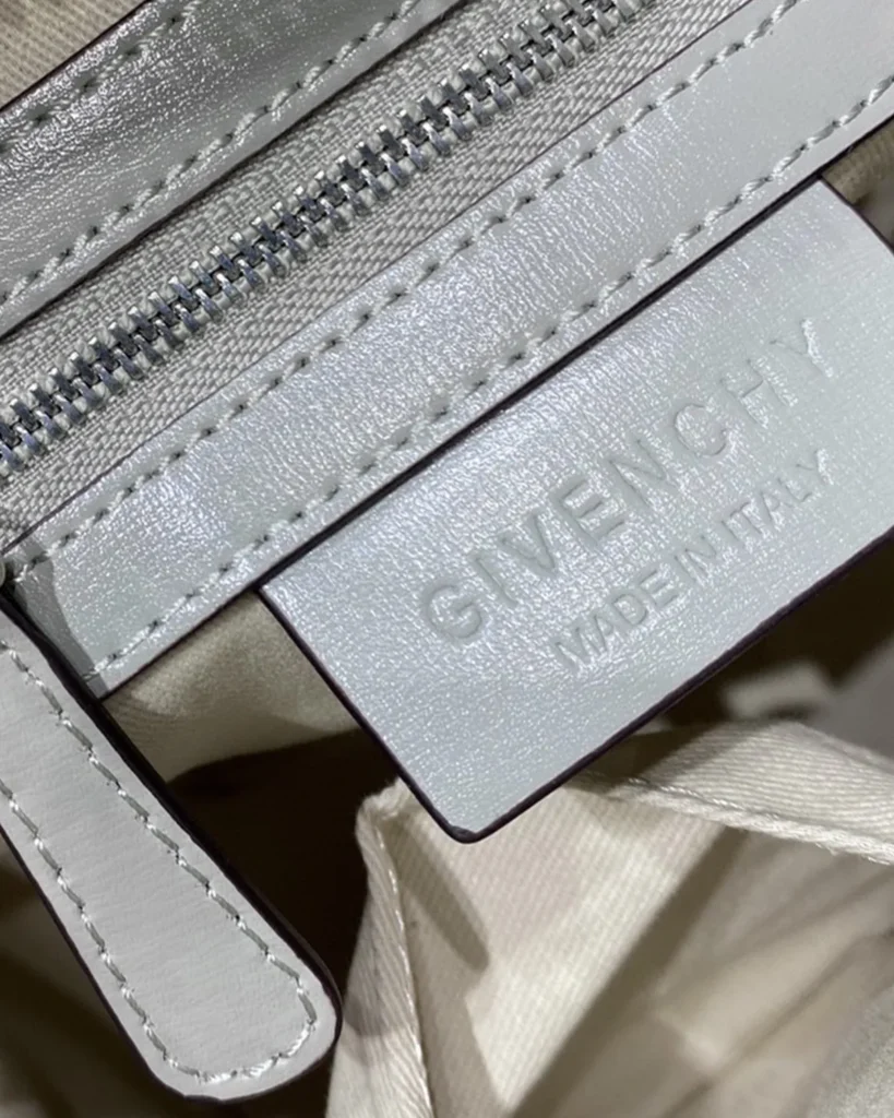 Pale Grey Architectural Top Handle Bag — interior label view
