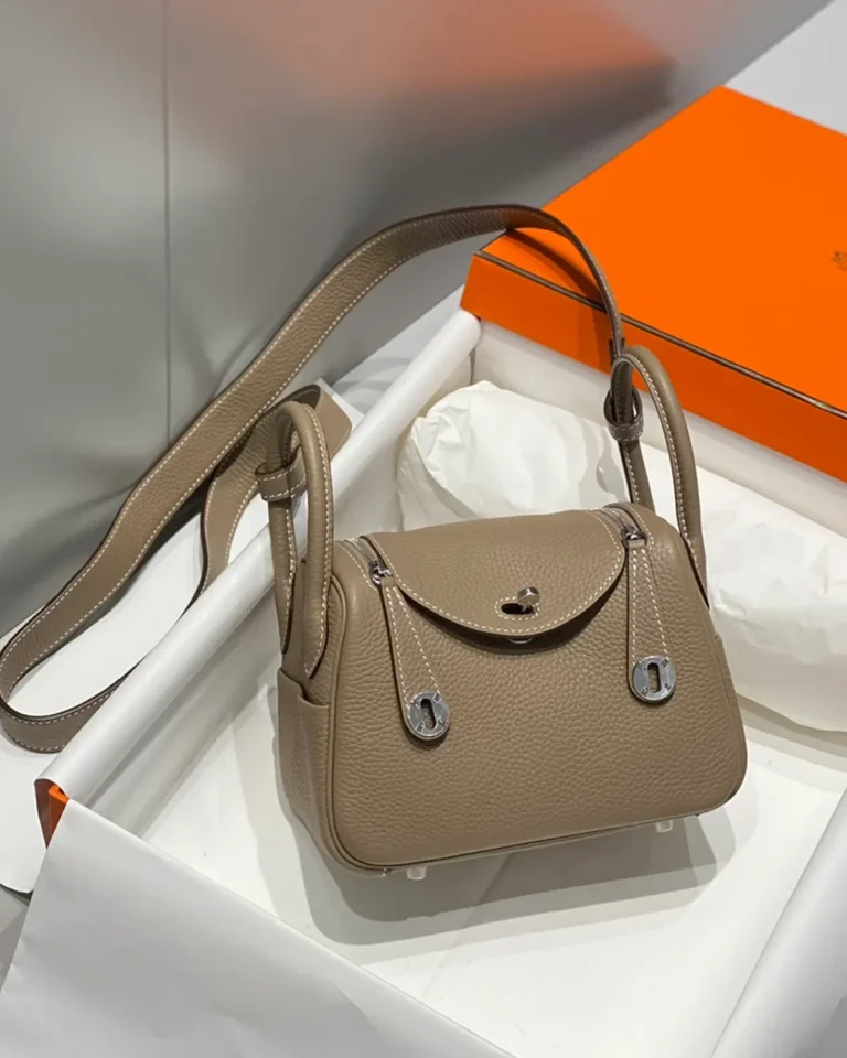 Lindy-Inspired Mini Taupe Crossbody Bag, three-quarter view in packaging