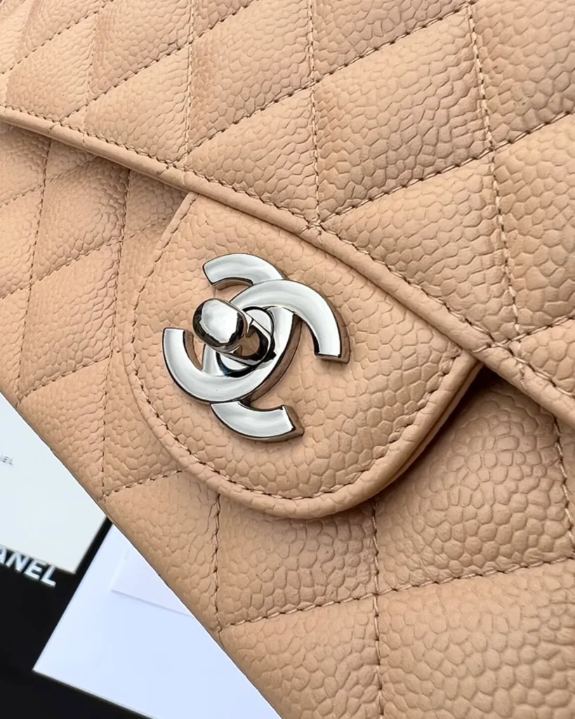Beige Quilted Chain Flap Bag — logo detail view
