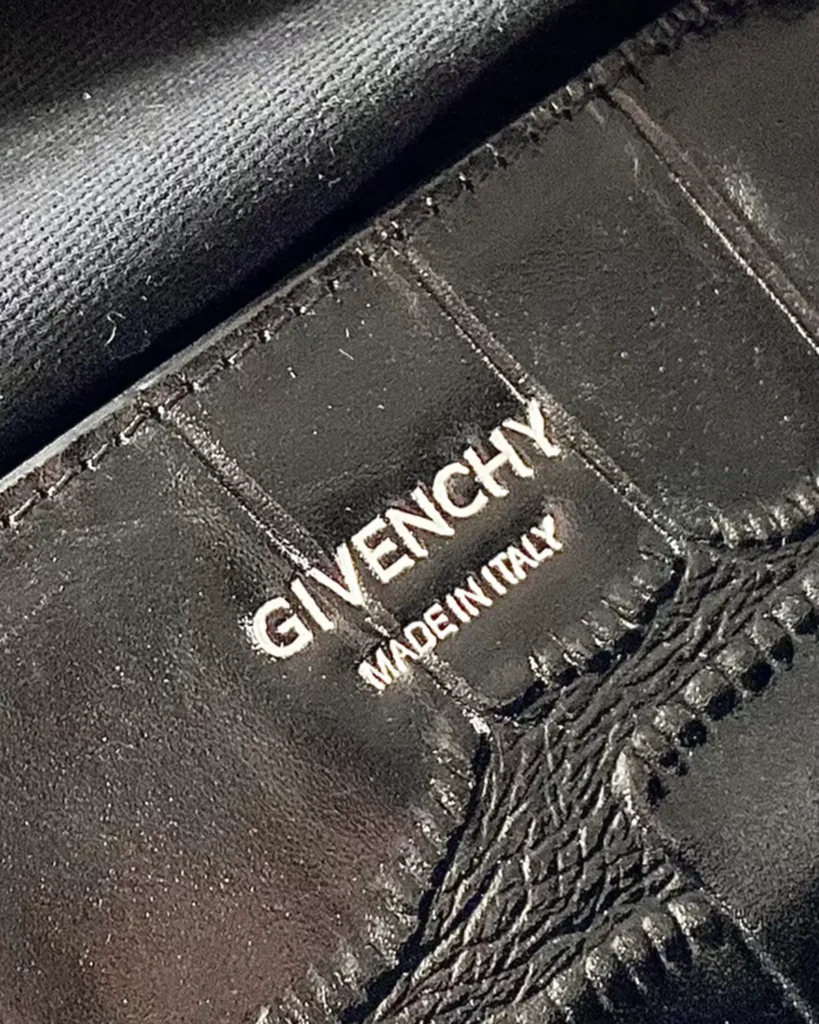 Black Scale-Pattern Padlock Handbag — label detail