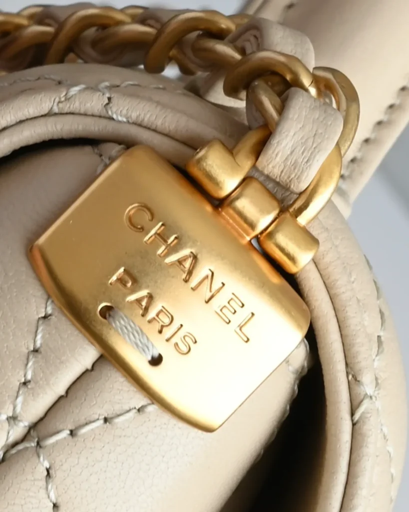 Pale Beige Quilted Top-Handle Flap Bag — chain detail view