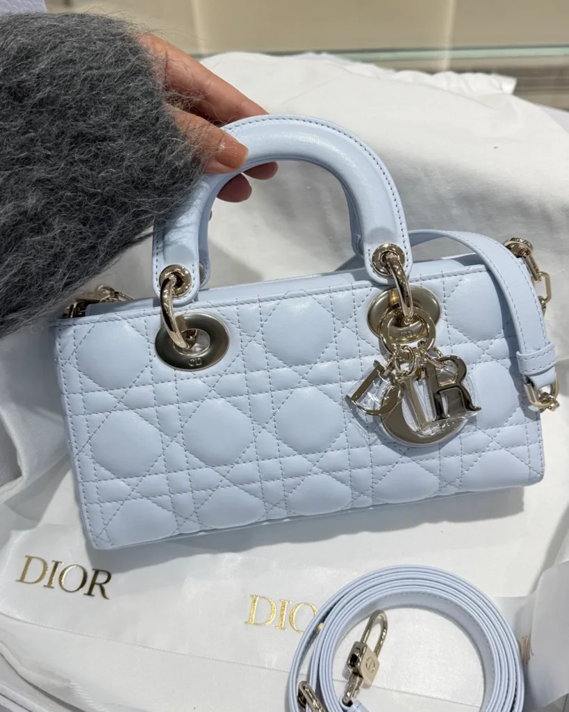 Pale Blue Horizontal Quilted Top Handle Bag — front view