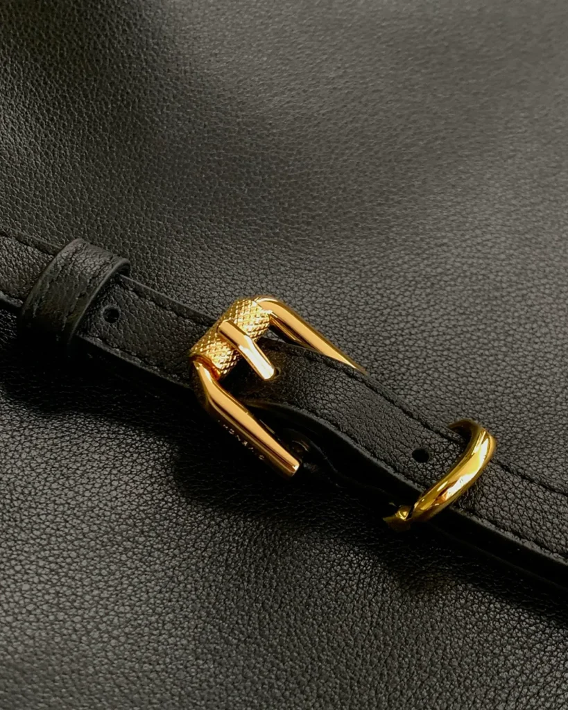 Black Curved-Top Buckle Shoulder Bag — buckle detail