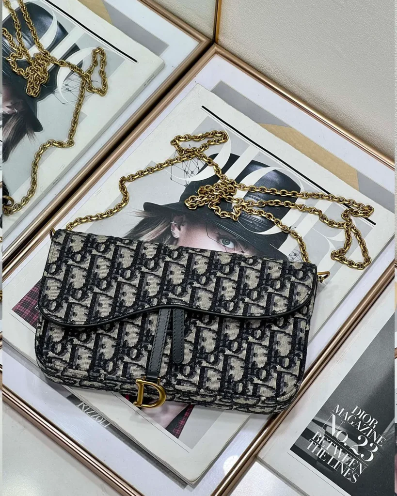 Navy Monogram Asymmetric Chain Pouch — overhead view