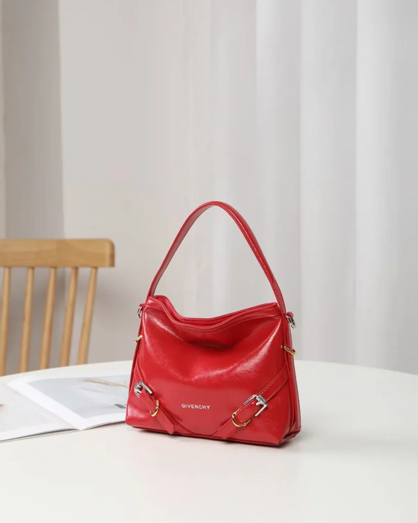 Glossy Red Buckle Shoulder Bag — angled front