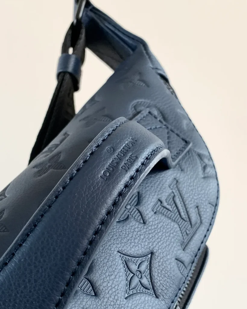 Dark Blue Embossed Monogram Waist Bag — handle view