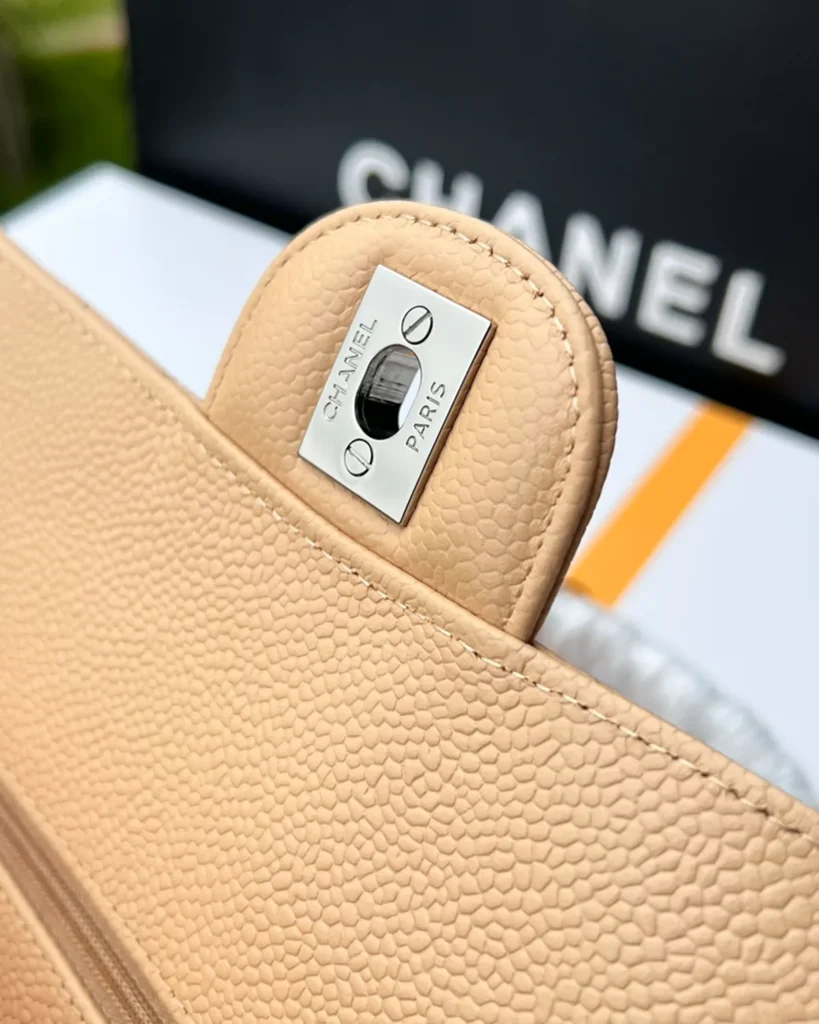 Beige Quilted Chain Flap Bag — closure detail view