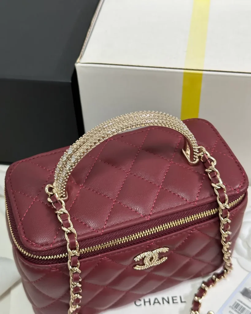 Burgundy Quilted Ornamental-Handle Vanity Bag — top view