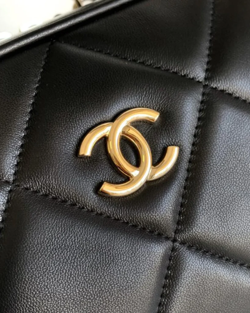 Black Quilted Bowling Bag — logo detail view