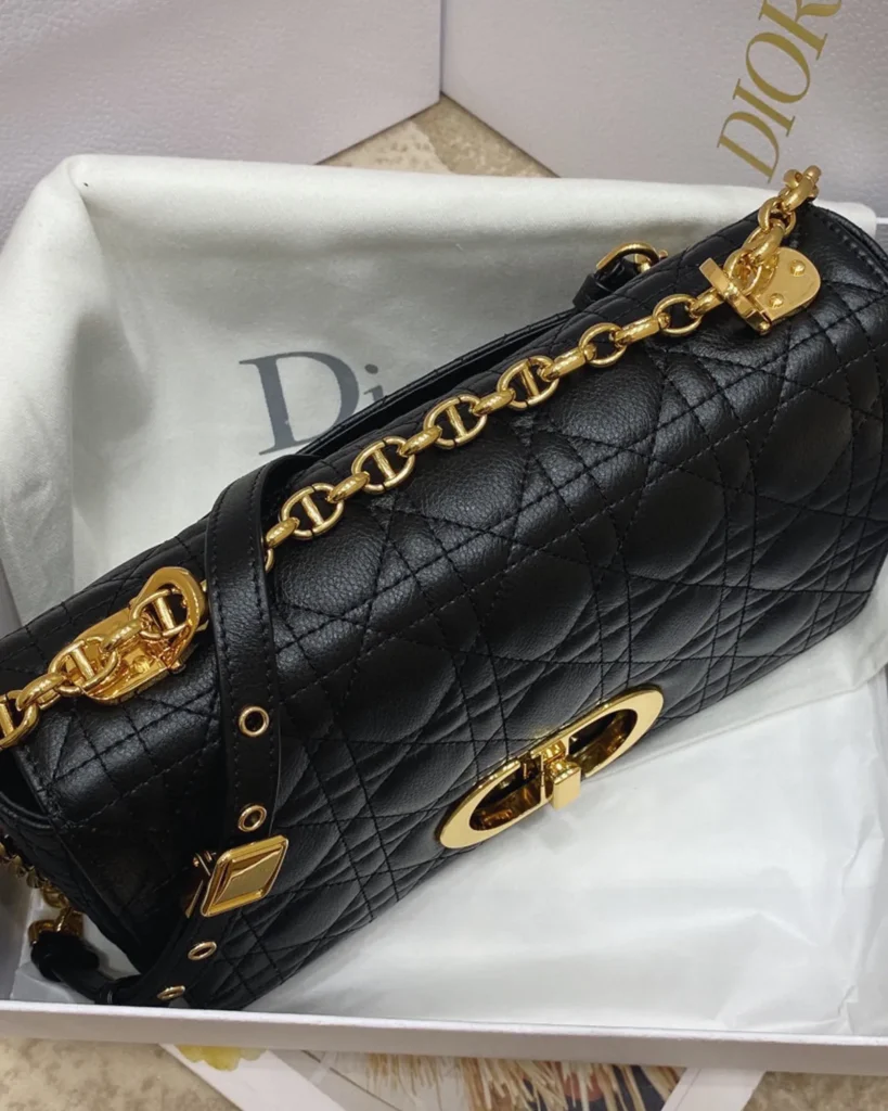 Black Quilted Flap Bag with Gold Tone Clasp — top view