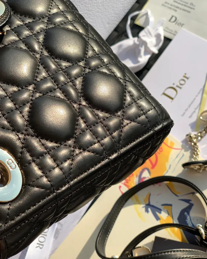 Black Quilted Compact Top Handle Bag — quilting detail view