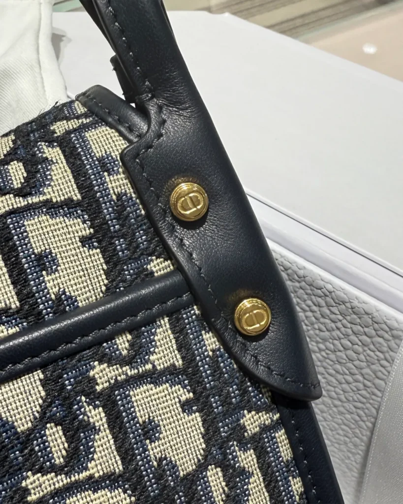 Navy Monogram Saddle Shoulder Bag — rivet detail view